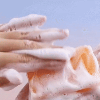 Hands lathering a cleansing bar